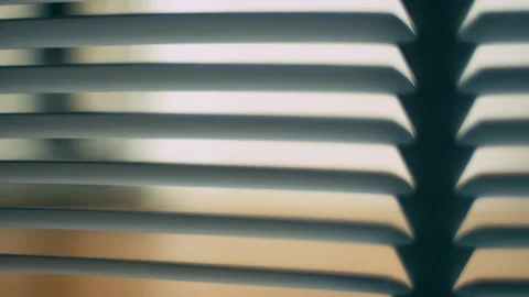Rack focus shot of a man's legs as he steps inside from a front door seen throug 動画素材 238917969