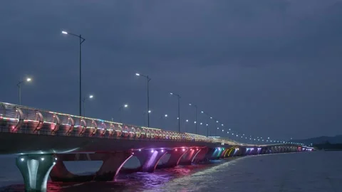 Rack Focus Shot of Rainbow Color Bridge at Night 库存影片 239698896