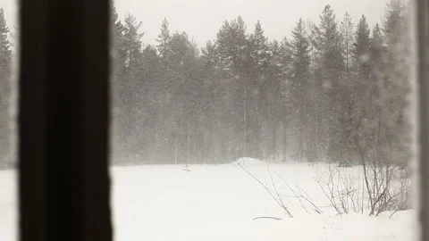 Rack focus shot of snow storm seen through a window Stock Footage 155549529