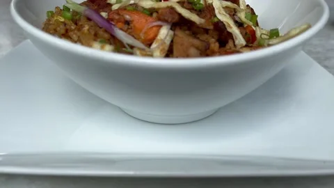 Rack focus shot Sri Lankan street food mixed fried rice plate dish Stock Footage 202644754