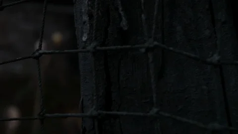 Rack focus slider of wall then net to skulls on spikes haunted 스톡 동영상 95962540