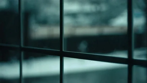 Rack Focus Snow Falling in Slow Motion Through Window Video stock 73338103