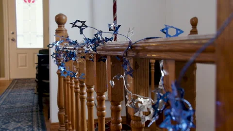 Rack focus star of david garland on bannister, Hanukkah decoration Stock Footage 295920791