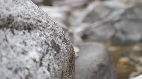 Rack focus  stone water river 4k Stock Footage 87862616