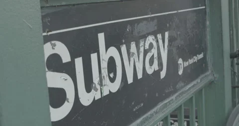 Rack focus on Subway sign New York City Stock Footage 223265084