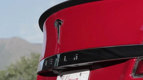 Rack Focus to Tesla Logo on Sedan Stock-Footage 64830859