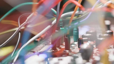 Rack focus through wires sound board Stock Footage 109425624