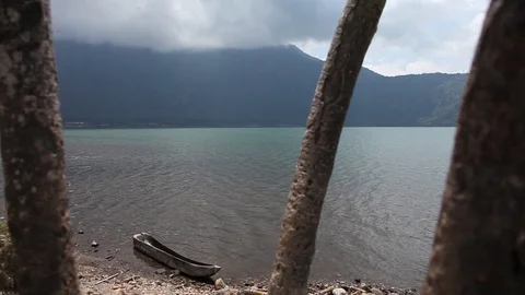 Rack Focus from Trees to boat in water Stock Footage 104417873