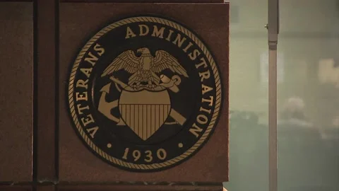 RACK FOCUS ON VETERANS ADMINISTRATION SEAL SIGN Vidéo 237736842