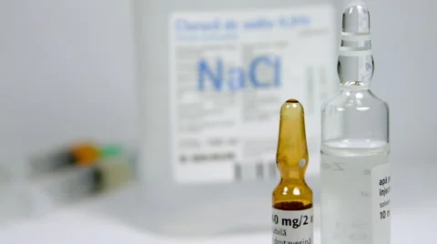 Rack Focus From Vials To NaCl Bottle And Then To Syringes, Isolated On White Stock Footage 47656986
