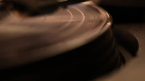 Rack focus on vinyl record under tungsten light Stock Footage 46492851
