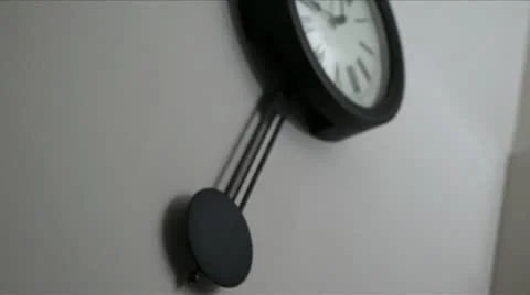 Rack Focus on Wall Clock Pendulum Stock Footage 21855042