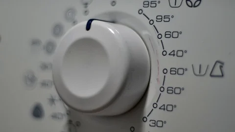 Rack Focus On A Washing Machine Programing Button, Household Appliance Video stock 70161418