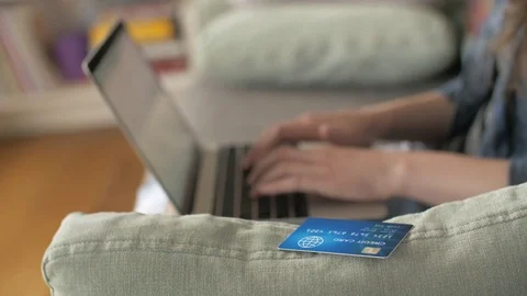 Rack Focus Of Woman Using Laptop And Credit Card Stock Footage 79657508