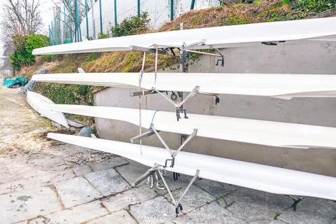 Rack holds several racing shells Stock Photos