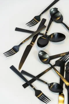 Rack of kitchen utensils, isolated on white. Stainless steel with black handles Foto stock