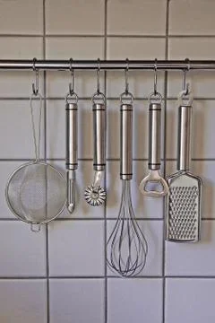 Rack of kitchen utensils Stock Photos