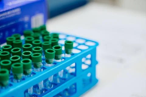 Rack of laboratory test tubes ready for sample collection in a medical facility Stock Photos