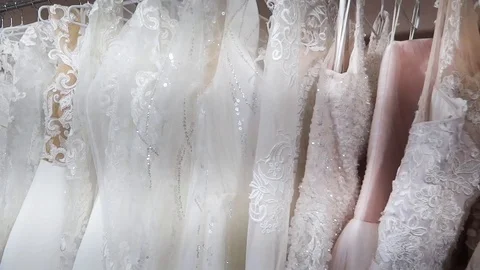 Rack with many wedding dresses. Stock Footage 116779159