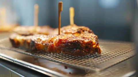 A rack of meat is being cooked on a grill Stock Footage 301517745