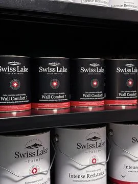 Rack with multi-colored paint containers. Art background. Swiss Lake brand paint Stock Photos