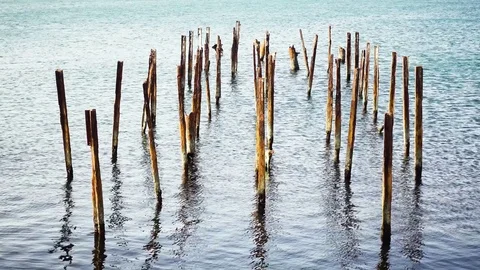 Rack pier posts rusty metal in the sea Stock Footage 82352236