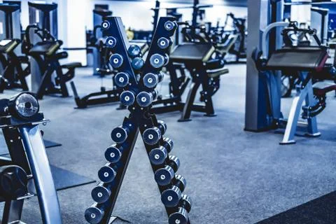 Rack with a set of dumbbells Stock Photos