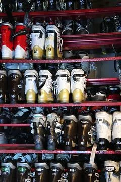 A rack of ski boots for rent Stock Photos