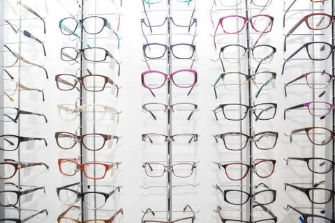 Rack with spectacle frames in an optician's shop Stock Photos
