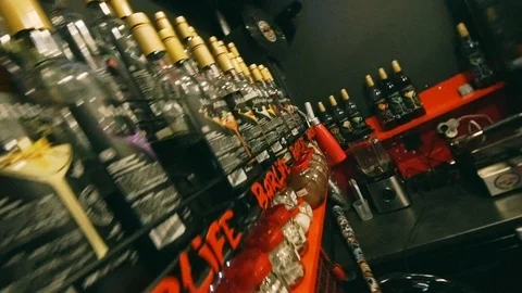 Rack with Syrup bottles in cafe Stockbeeldmateriaal 115699415