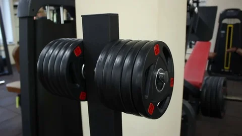 Rack with a weight plate In training gym Stock Footage 70312605