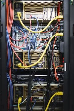 Rack, wiring and computing equipment in server room for database storage, c.. Stock Photos