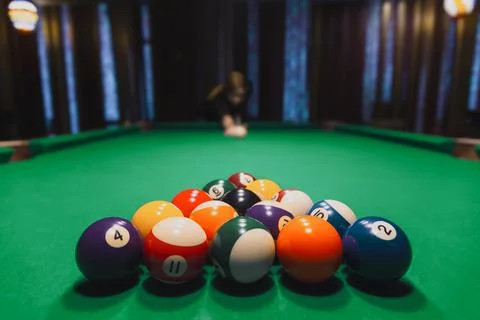 Racked Billiard Balls With Player Aiming Stock Photos