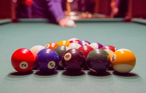Racked billiard balls on a pool table Stock Photos