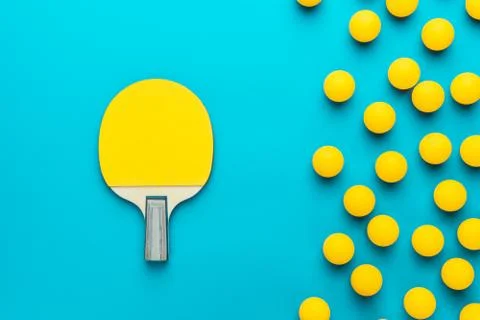Racket and many balls for table tennis on turquoise blue background Stock Photos
