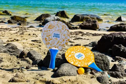 Rackets on the beach, summer concept. Stock Photos