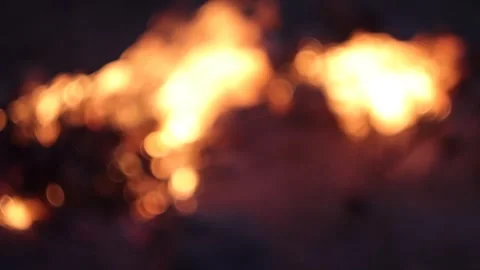 Racking Focus from Bokeh to Campfires in the Evening Stock Footage 303522604