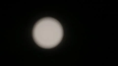 Racking focus shot of full moon with clouds Stock Footage 54558105