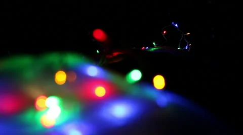 Racking soft focus shot of colorful outdoor Christmas lights Stock Footage 47916131