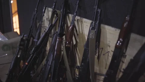 Racks of AK-74 Rifles in Repurposed Military Staging Area Stockbeeldmateriaal 333382025
