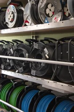 Racks with technical equipment, TV cables and coils, sound cables Stock Photos