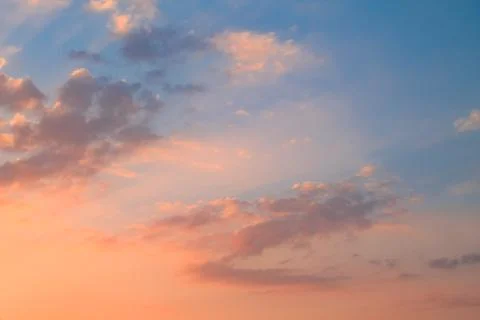 The rad clouds during sunset and the blue sky Stock Photos