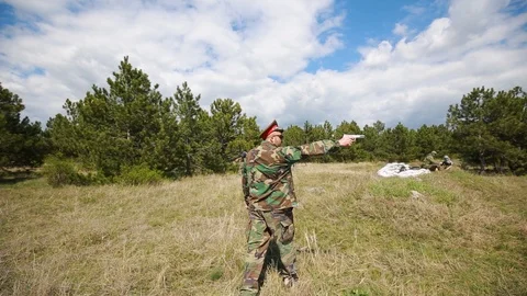 Radar base at forest. The commander goes around the base, looking around Stock Footage 128000700