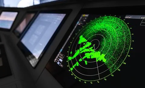 Radar screen with green display indication on a captains bridge Stock Photos