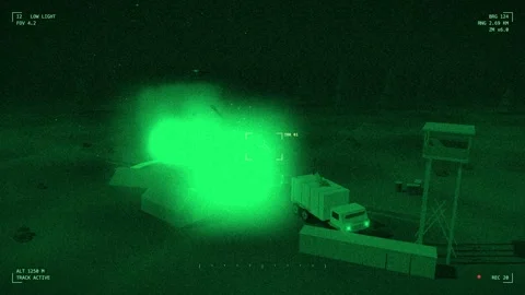 Radar site hit by a stick of bombs seen on night vision Video stock 342333246