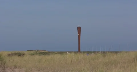 Radar Tower, built adjacent to the new seawall at Maasvlakte 2 Stock Footage 115716110