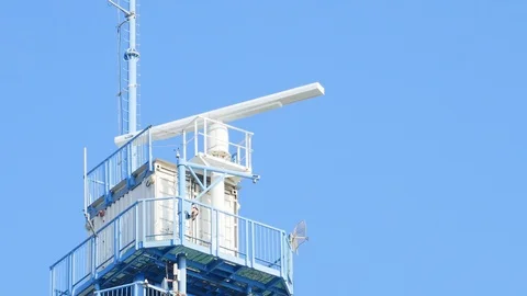 Radar tower close-up with spinning antenna Stock Footage 89487805