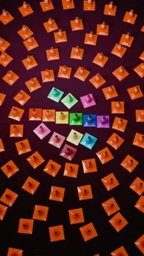 Radial array of orange traffic cones around rainbow center on dark gradient.. Foto stock