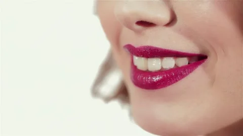 Radiant close-up of a young woman's lips showcasing vibrant makeup Stock Footage 311673579