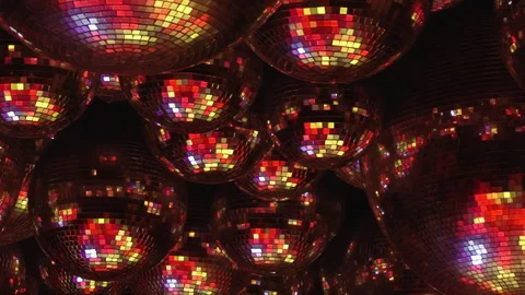 Radiant Disco Balls Create a Kaleidoscope of Color at Night Stock Footage 334924129